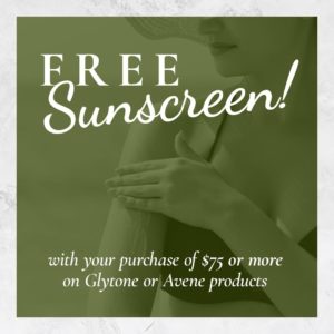 The Skin Center: FREE Sunscreen! with your purchase of $75 or more on Glytone or Avene products. Image: A fomapn in a bathing suit and floppy hat applying sunscreen to her right arm underneath a green-colored filter